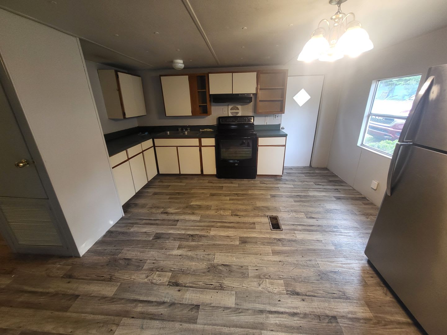 Freshly painted spacious 2-bedroom 1-bath home with a screened porch and storage shed. – photo 2
