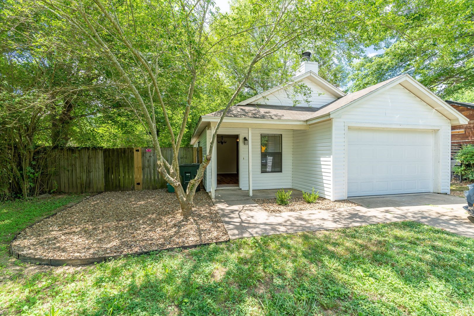 Refreshed 3 BR/2 BA home near I-49/UofA! Large fenced yard! – photo 1