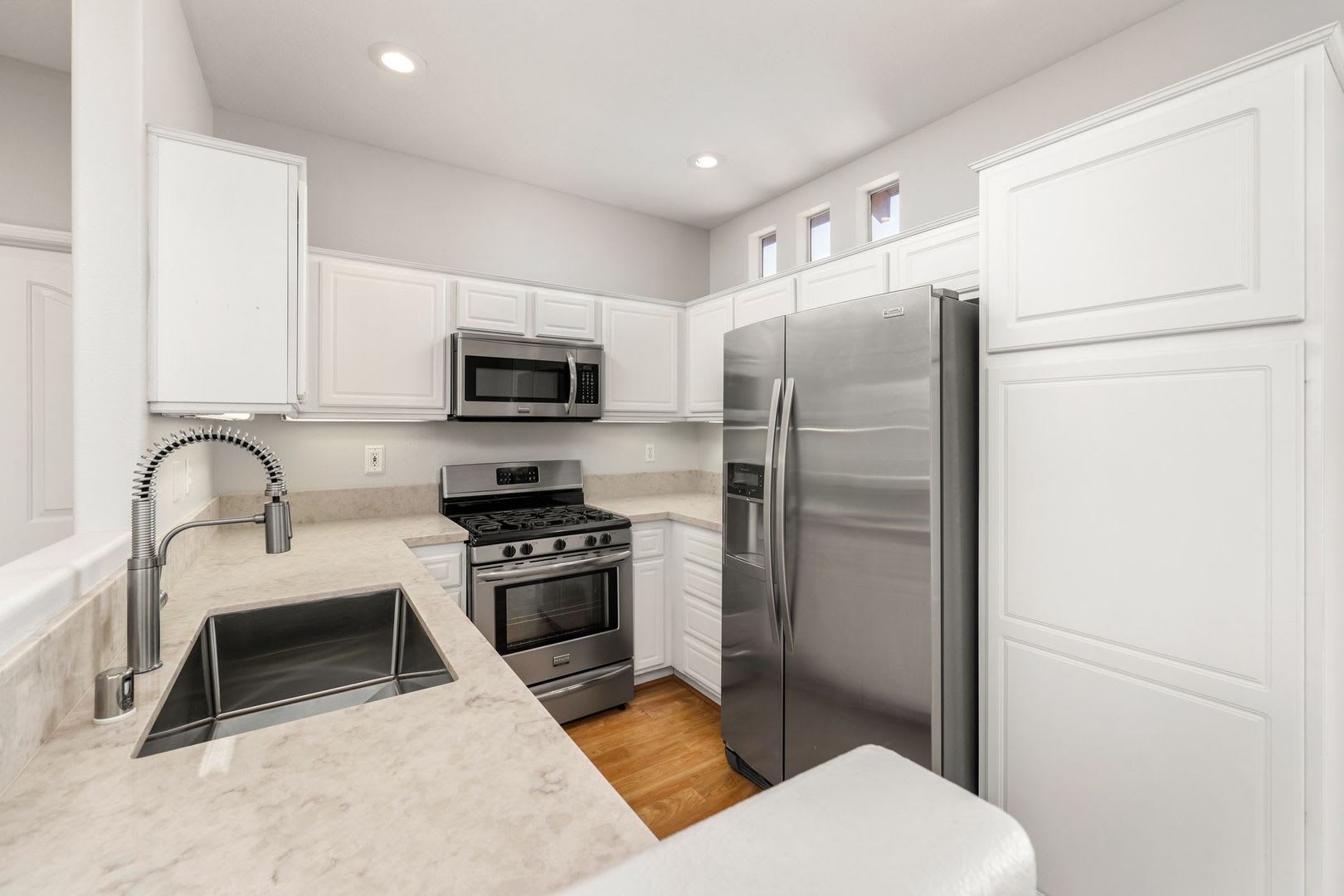 Bright Second Story Condo with 2 Car Garage in The Orchards – photo 4