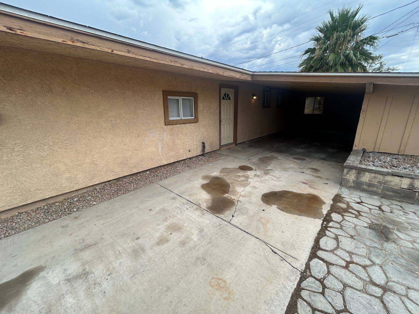 Single story home with large backyard and huge carport with plenty of storage. – photo 2