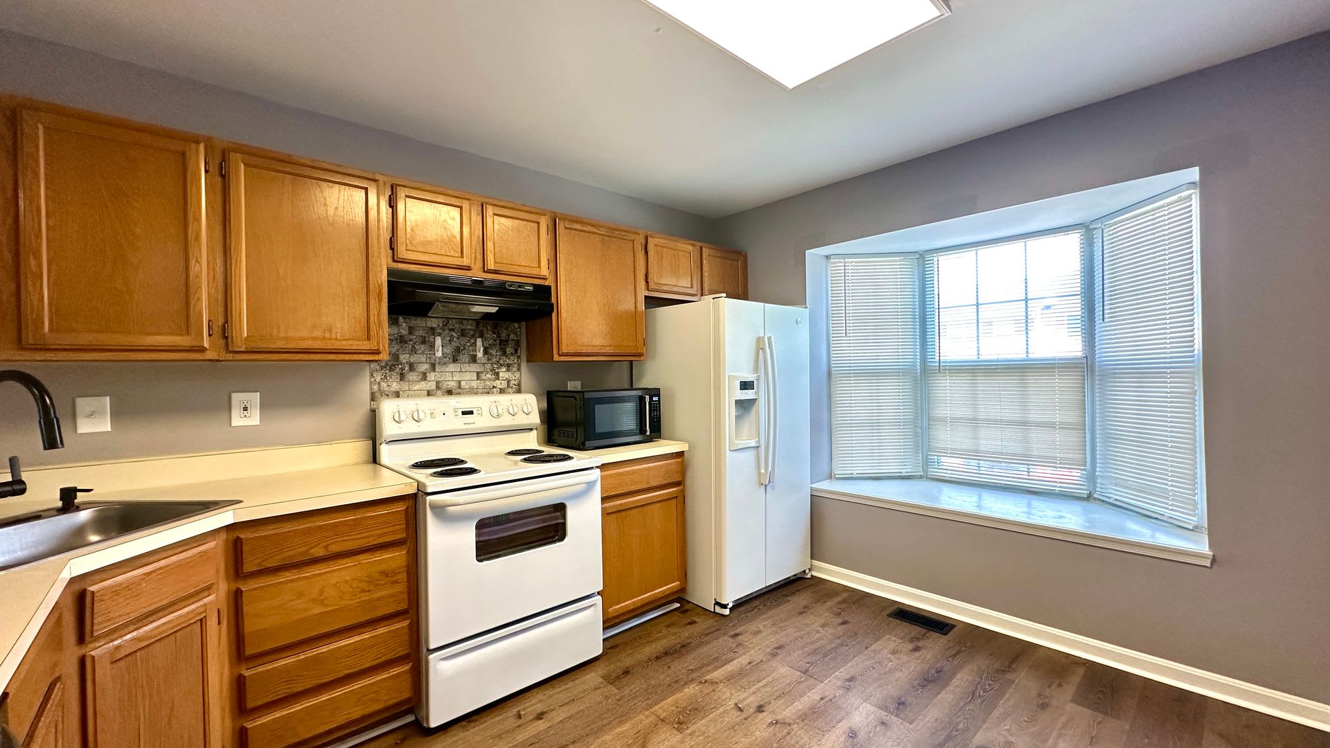 Updated 3-Bedroom Townhome with Finished Walkout Basement, Fenced Yard & Deck – photo 3