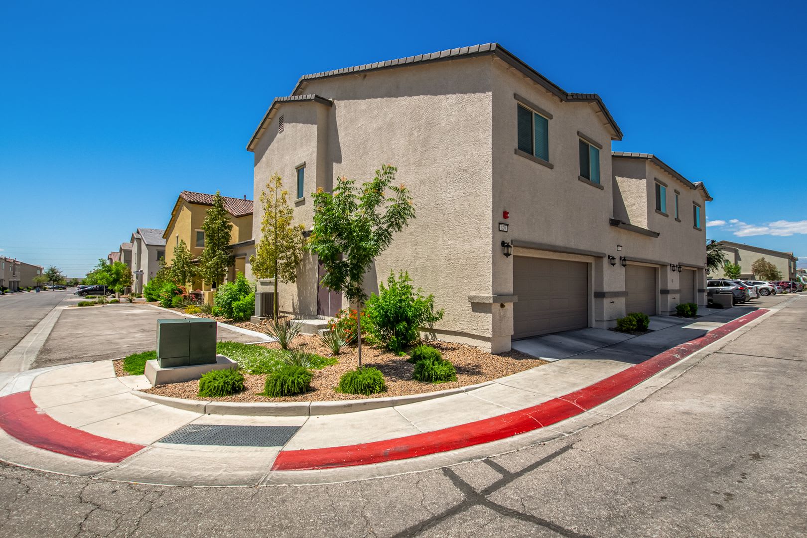 Beautiful corner lot townhome with custom paint, plentiful community green spaces. – photo 2