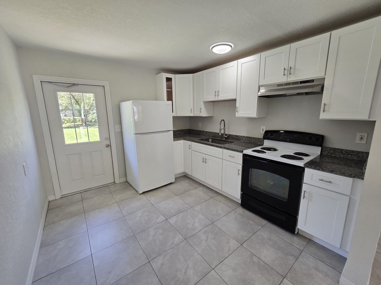 Beautiful Open Floor Plan 2 Bedroom 1 Bathroom Home 2 Car Parking Open Kitchen With Wood Cabinets And Newly Installed Tile Flooring Throughout The Home – photo 3