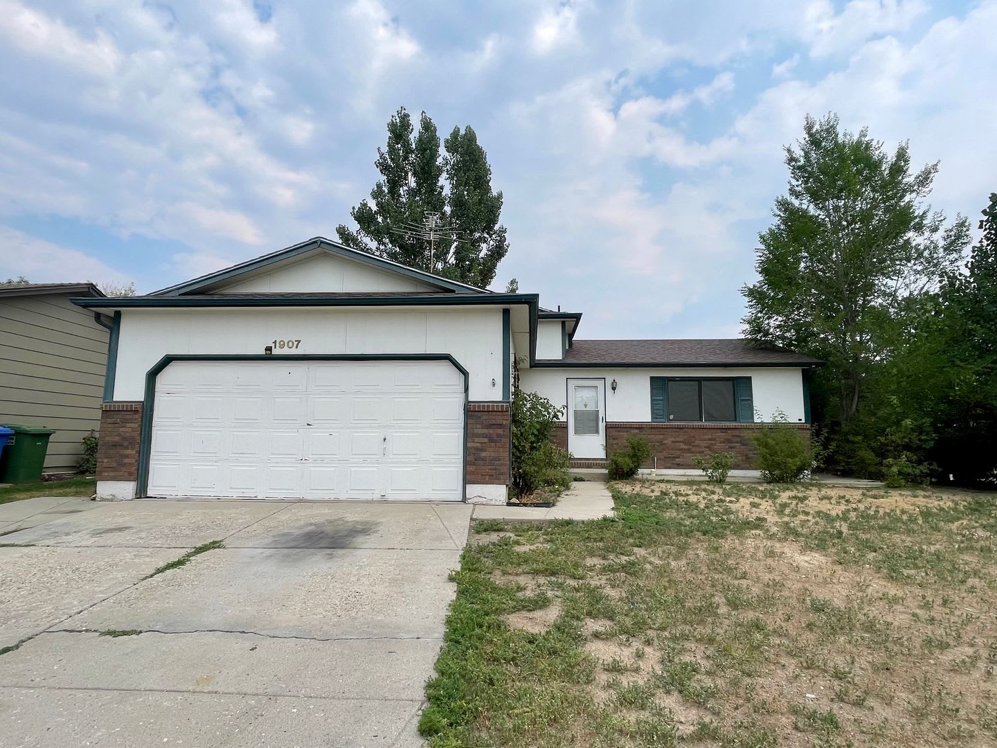 4 Bed, 2 Bath Loveland, CO Home- Fenced Backyard, A/C, & 2 Car Garage! – photo 2