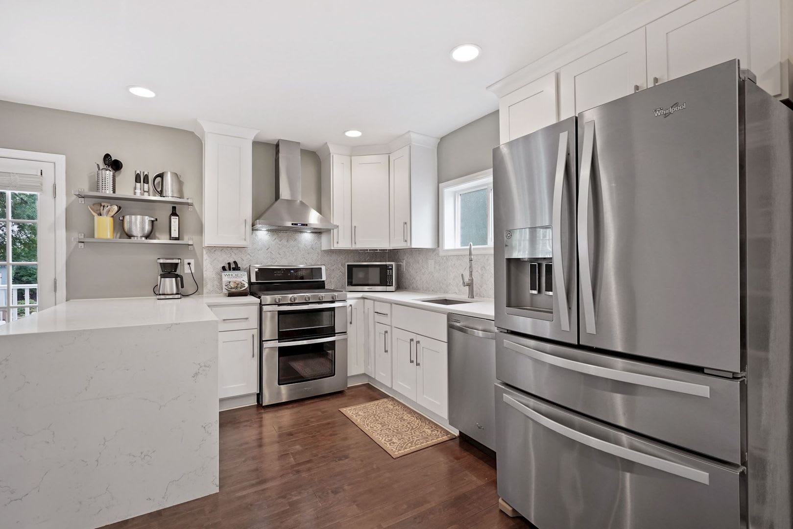 Renovated Cape Cod with Den, Garage, Driveway & Spacious Backyard – photo 1