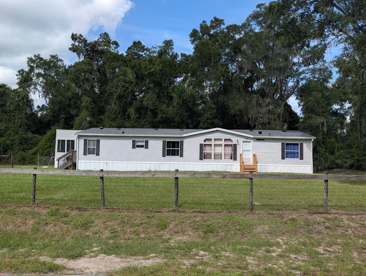 3 bedroom 2 bath with NEW roof on 1/2 acre of land with a FENCED YARD – photo 1