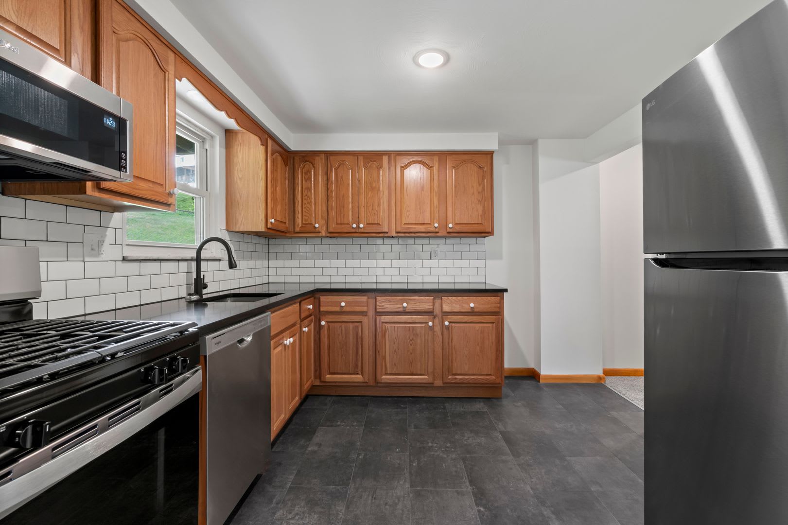 Ready for move-in! Don’t miss this RENOVATED 2-bedroom townhome in West Mifflin! – photo 1