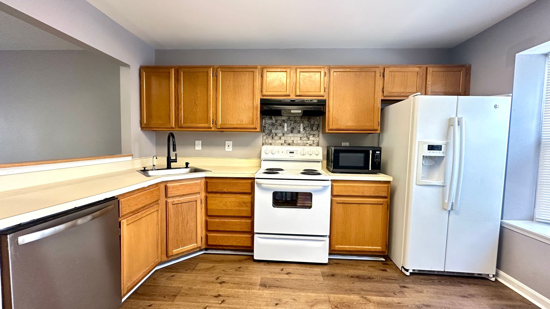 Updated 3-Bedroom Townhome with Finished Walkout Basement, Fenced Yard & Deck – photo 2