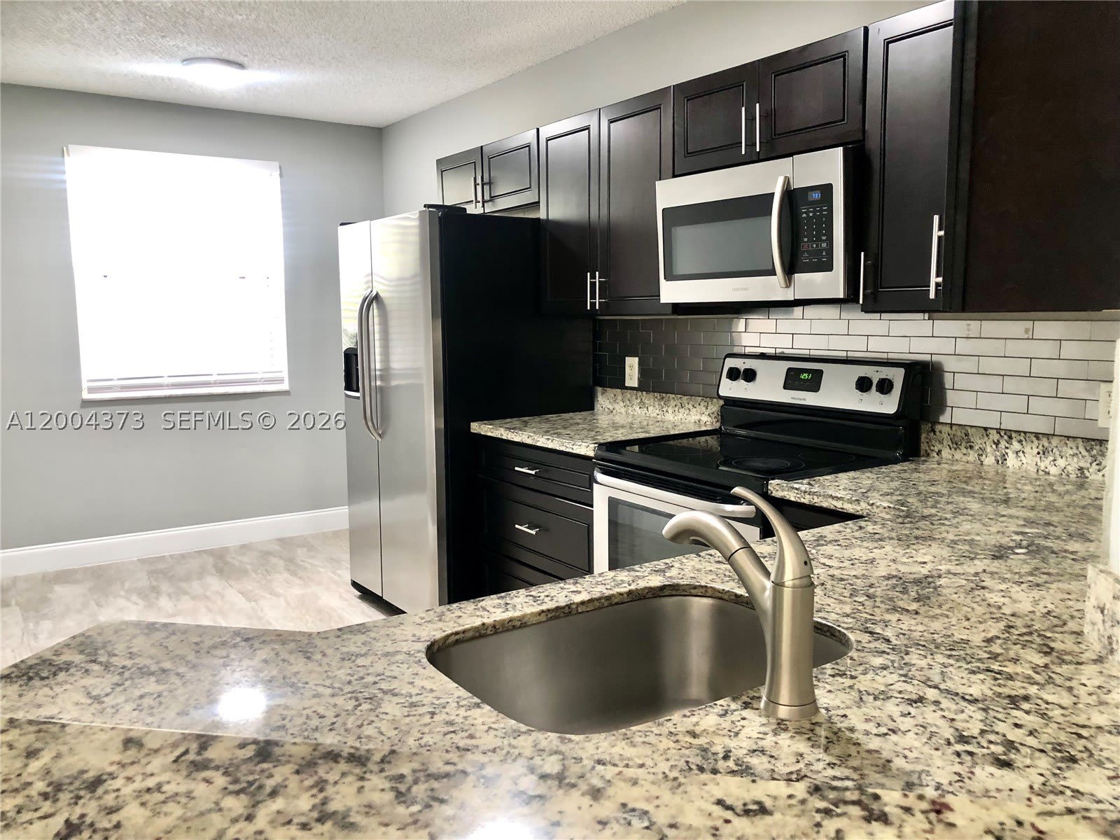 8761 Wiles Rd – photo 1
