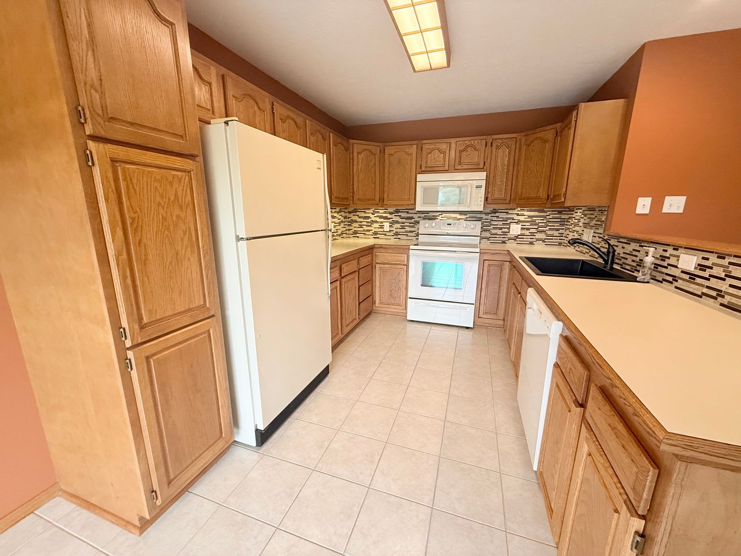 Spacious Townhome with Finished Basement, Fenced Yard & 2-Car Garage – photo 2