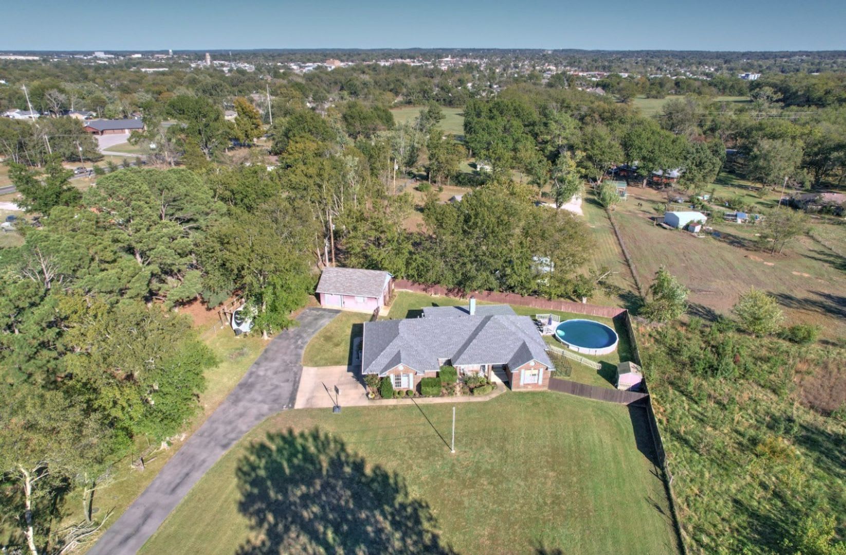 Private on 1.2 acres 3/2.5 bath w/2 car garage/20x30shop &pool – photo 1