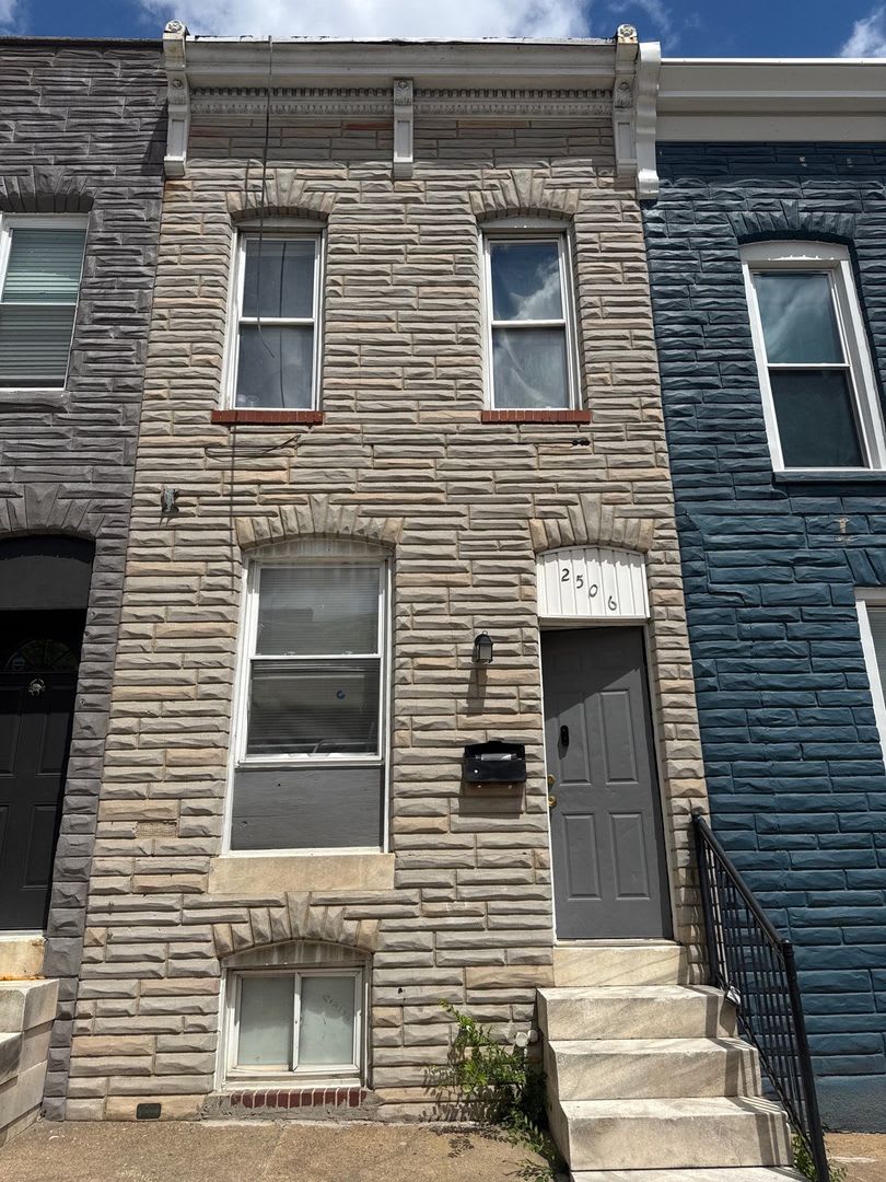 Charming Baltimore Townhouse with Exposed Brick & Modern Upgrades – photo 1